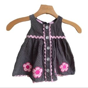 Subtle cord sleeveless dress with flowers and such prey buttons.